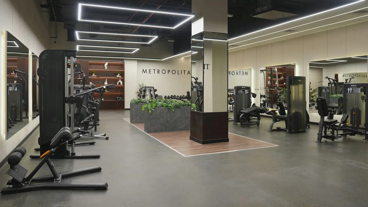 The bright women-only gym floor with a planted central island